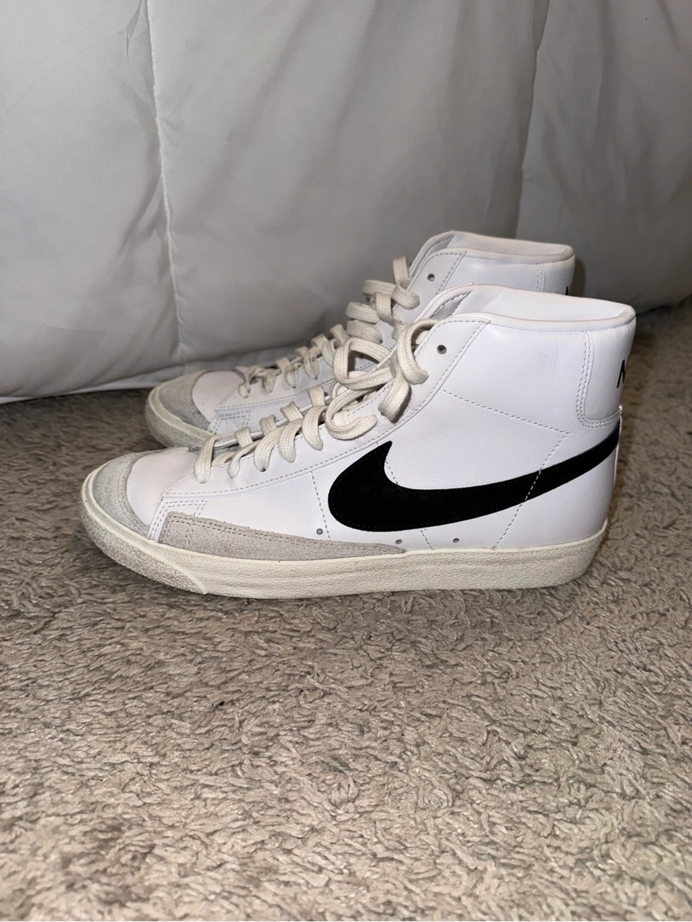 Nike White High-Top Sneakers with Black Swoosh